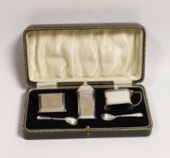 A cased George VI silver three piece condiment set, Elkington & Co, Birmingham, 1936 and two