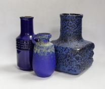 Three West German pottery vases in blue ground, one with lava glaze, tallest 22cm