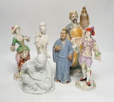 Eight porcelain figures including a pair of German style figures, a large Figo group, feeding a