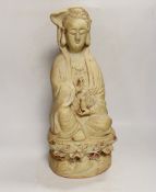 A Chinese biscuit figure of Guanyin, 38cm high