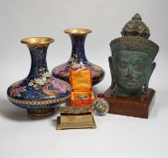 A Thai bronze model of a Buddha head, a pair of Chinese cloisonné vases, reverse painted snuff