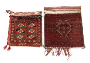 Two late 19th / early 20th century Caucasian saddle bags, largest 132cm long x 59cm wide