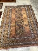 An Afghan gold ground rug, 224 x 151cm
