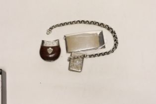 An Edwardian silver vesta case on a white metal belcher link chain, a 19th century white metal