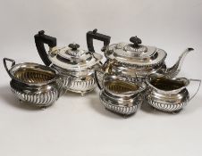A late Victorian demi fluted silver three piece tea set, William M. Hayes, Birmingham, 1897,