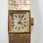 A lady's 9ct three colour gold Beuche Girod manual wind bracelet wrist watch, overall 16.7cm,