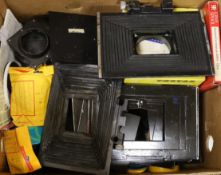 A collection of vintage cine camera matte boxes, baseplates and other items including film