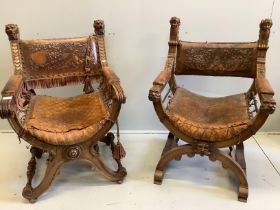Two continental carved x-framed elbow chairs, each with tooled leather backs and carved terminals,