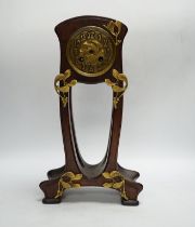 A French Art Nouveau mahogany and brass-mounted mantel clock, 39cm