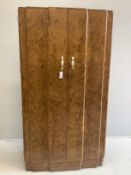An Art Deco style burr walnut compactum wardrobe, width 96cm, depth 52cm, height 182cm