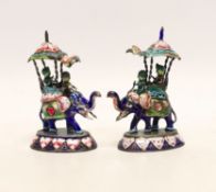 A pair of Indian gilt white metal and polychrome enamel elephants with howdahs, height 77mm.