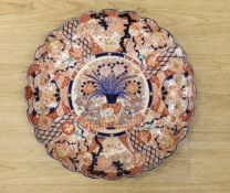 A large Japanese Imari floral charger, 58cm diameter