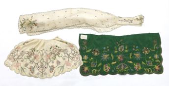 A late 18th century green silk scalloped bordered lady’s apron border, ornately embroidered with