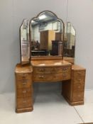 An Art Deco style burr walnut kneehole dressing table, width 136cm, depth 53cm, height 188cm