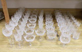 A part suite of Waterford drinking glassware, including champagne glasses, brandy glasses, liquor