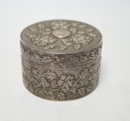 An early 20th century Chinese white metal circular box and cover, maker's mark MK, with foliate