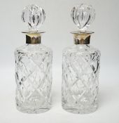 A modern pair of silver mounted cut glass cylindrical decanters with stoppers, Birmingham, 1971/