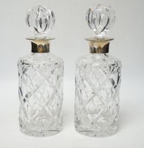 A modern pair of silver mounted cut glass cylindrical decanters with stoppers, Birmingham, 1971/