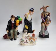 Four Royal Doulton character figures, a Royal Crown Derby Koi Carp paper weight, a continental putti