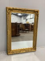 A Victorian style rectangular gilt composition wall mirror, width 80cm, height 112cm