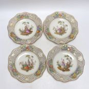 A set of four Dresden cabinet plates decorated with lovers, 22cm high