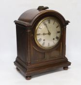 An Edwardian mantel clock, with two train movement, striking and chiming on five coiled gongs,