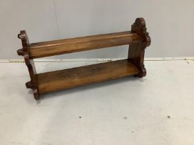 A late Victorian walnut two tier wall bracket, width 74cm, depth 20cm, height 37cm