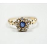 A late Victorian 18ct gold, sapphire and diamond set circular cluster ring, Birmingham, 1889, size