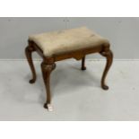 A Queen Anne Revival walnut dressing stool, width 64cm, depth 48cm, height 51cm