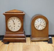 Two early 20th century mantel clocks; a mahogany timepiece and an inlaid Edwardian clock with engine