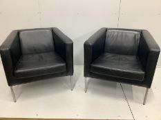 A pair of contemporary black leather armchairs, width 77cm, depth 69cm, height 72cm