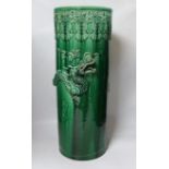 An early 20th century Japanese green glazed ‘dragon’ stick stand, 61cm