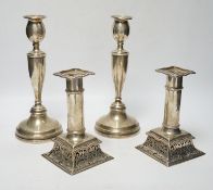 A pair of Victorian silver candlesticks, on pierced swept bases, William Leuchars, London, 1886,
