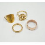 A 1930's 22ct gold wedding band, 5.9 grams, a 9ct gold wedding band, 5.1 grams and two other
