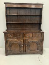 An 18th century style oak dresser, width 137cm, depth 47cm, height 180cm