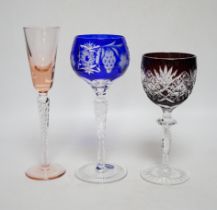 Two sets of six Harlequin colour flashed hock glasses and a set of four air twist glasses