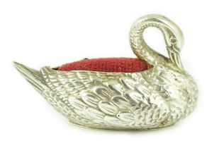 An Edwardian novelty silver pin cushion, modelled as a swan, Adie & Lovekin Ltd, Birmingham, 1906,