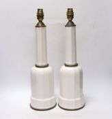 A pair of white glazed ceramic Heiberg lamps, 45cm