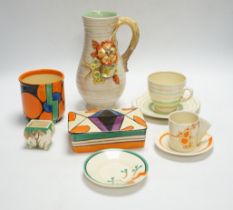 A Clarice Cliff Fantasque butter dish and cover, a Bizarre pot and five other Clarice Cliff items,