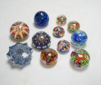 A collection of coloured glass paperweights including Strathearn, Caithness (28)