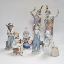 A collection of twelve Lladro figures and a Lladro plaque