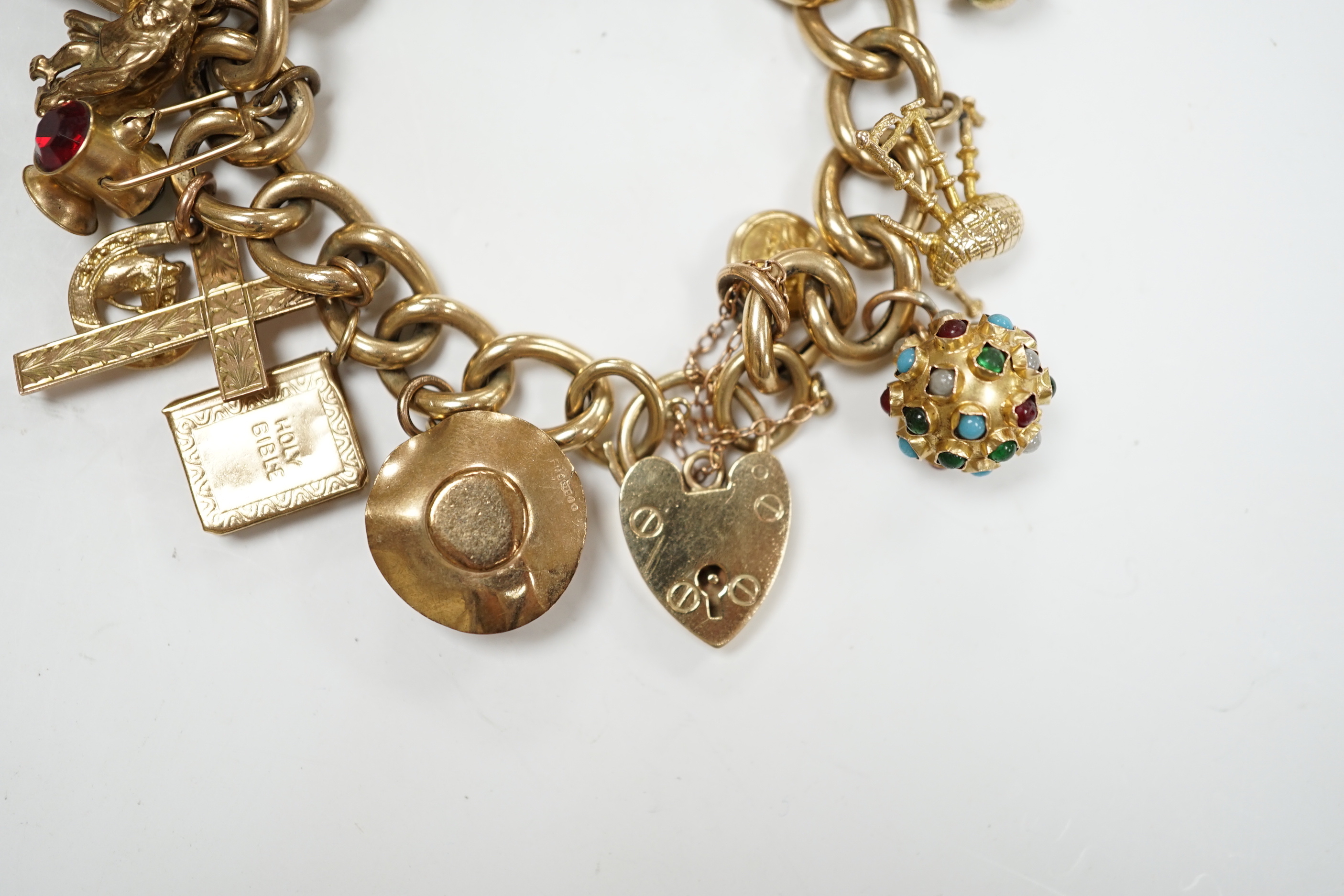 An early 1960's 9ct gold curb link charm bracelet, hung with fifteen assorted charms, including - Image 2 of 6