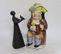 A Royal Doulton figurine 'Peace' and a Doulton style Toby jug, largest 26cm high