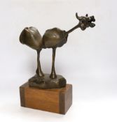 An abstract bronze model of a cow, 34cm