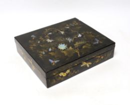 A 19th century lacquer games box with sectional interior and a collection of 49 mother of pearl