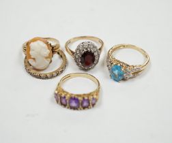 Five assorted modern 9ct and gem set dress rings, including graduated five stone amethyst and