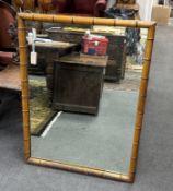 A late 19th/ early 20th century French simulated bamboo rectangular cherry wall mirror, width