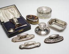 A cased silver christening egg cup and spoon and other items including nail buffers, inkwell,
