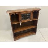 An Arts and Crafts oak open bookcase with leaded glazed door, width 102cm, depth 25cm, height 104cm