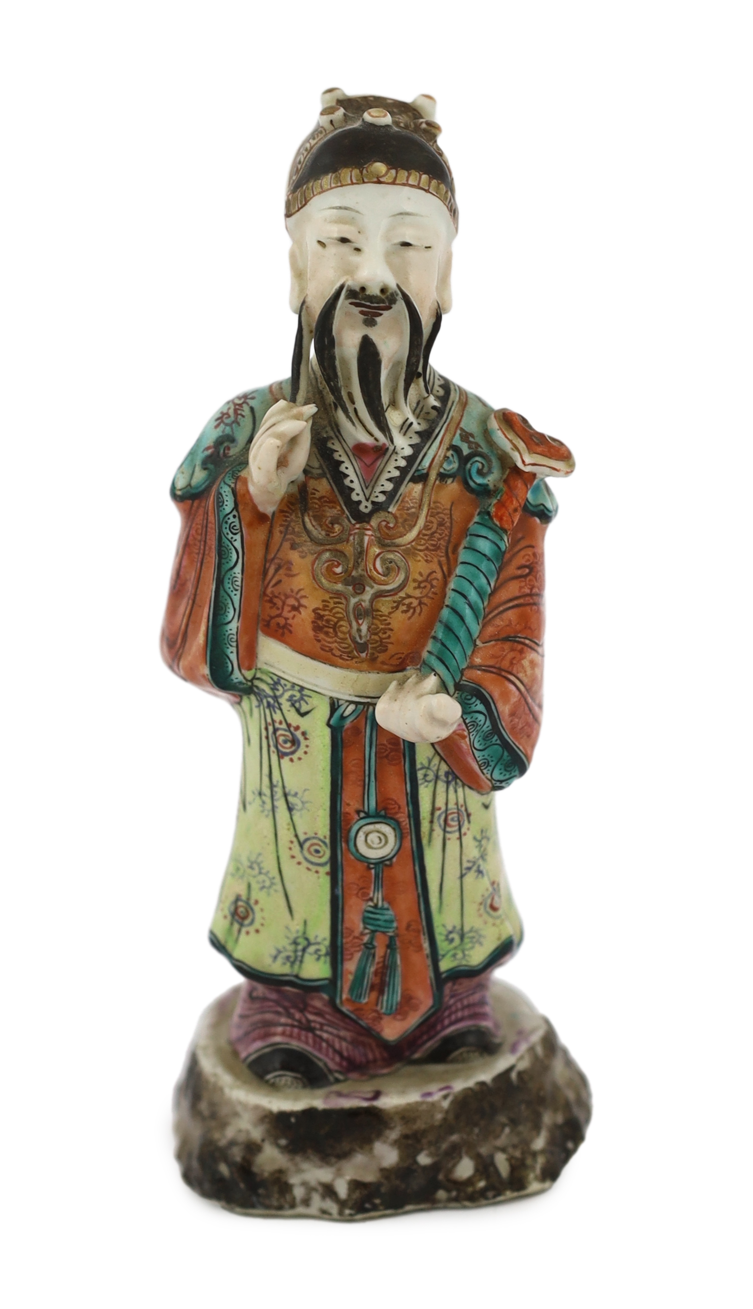 A Chinese enamelled porcelain figure of a court official, Jiaqing period (1796-1820), standing and